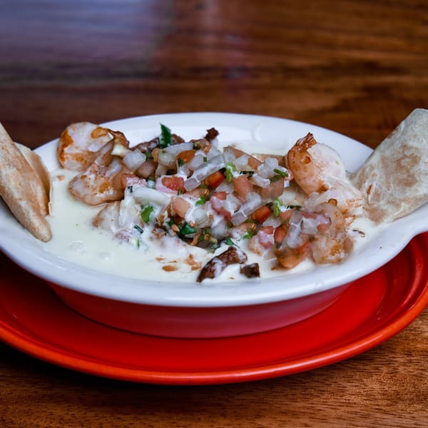 La Patrona Cantina and Grill's shrimp dish with creamy sauce, pico de gallo, and tortillas.